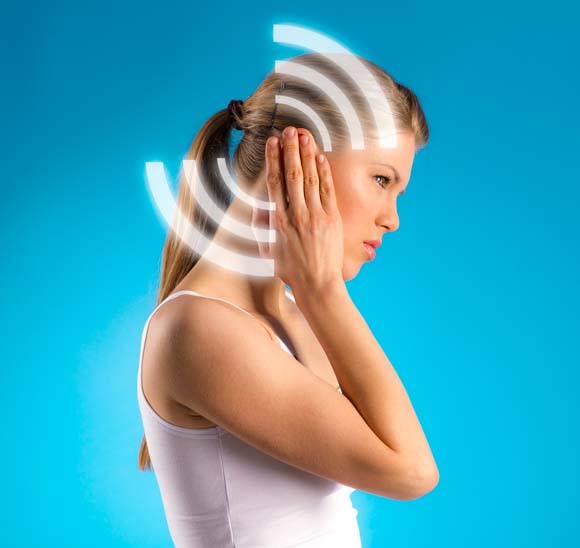 Waves of tinnitus pictured over a model's ear. 