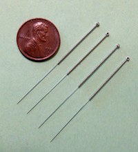 Image of one inch filiform needles. 