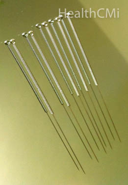 A close up look of acupuncture needles with wound handle. 
