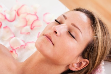 Facial acupuncture is demonstrated. 