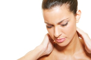 This photo shows neck discomfort on a young woman. 