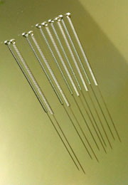 Acupuncture needles are shown. 
