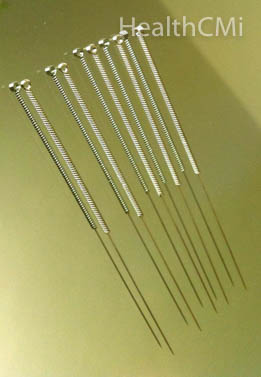 A close up look of acupuncture needles with wound handle.